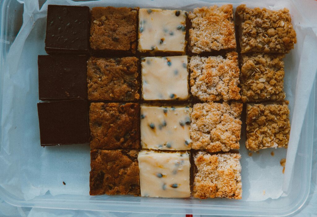 A top view of assorted pastry slices in a container, perfect for dessert lovers.